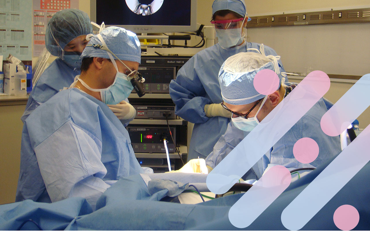 Surgeons perform a breast reconstruction procedure