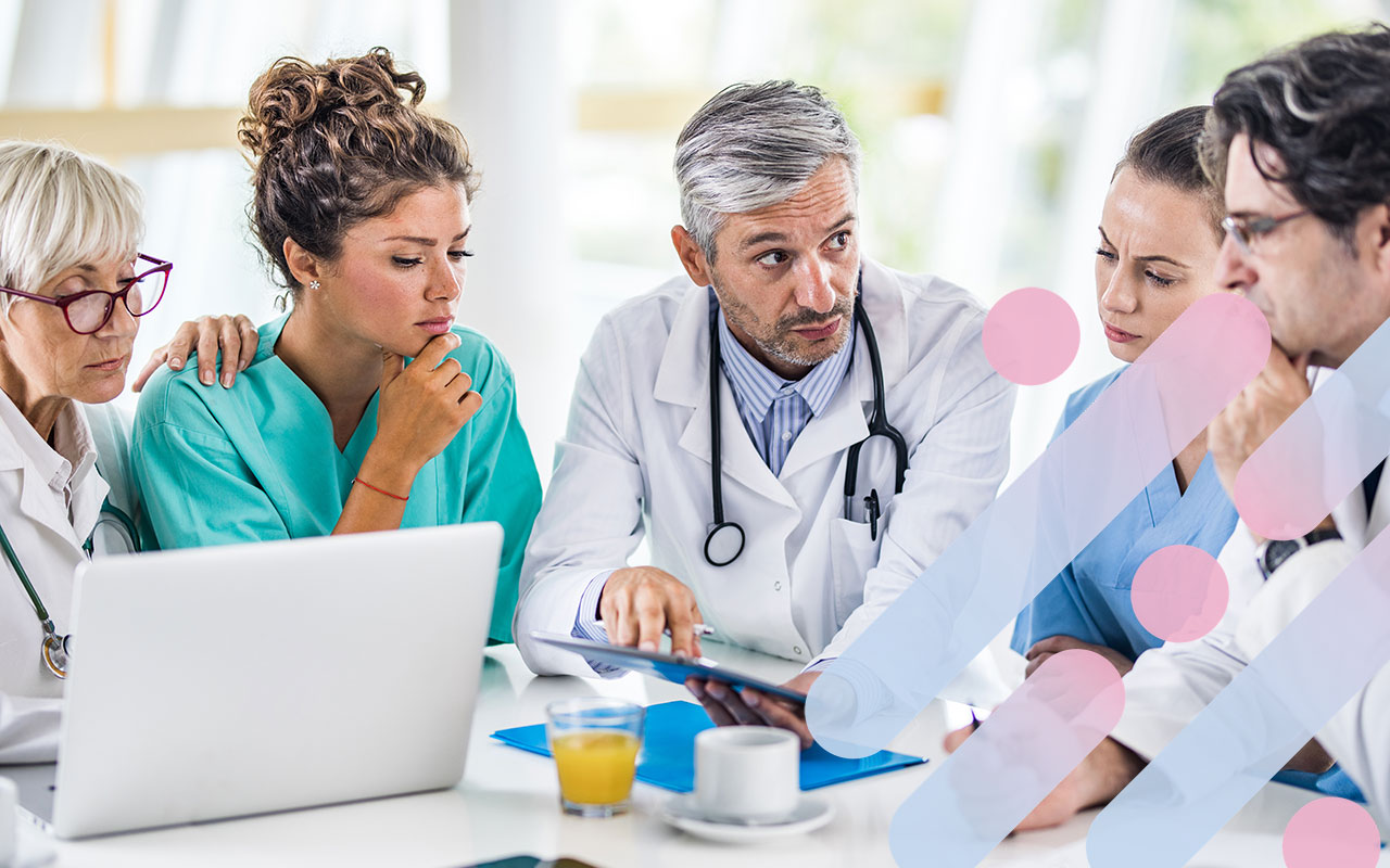 A patient discusses breast reconstruction options with a surgical team