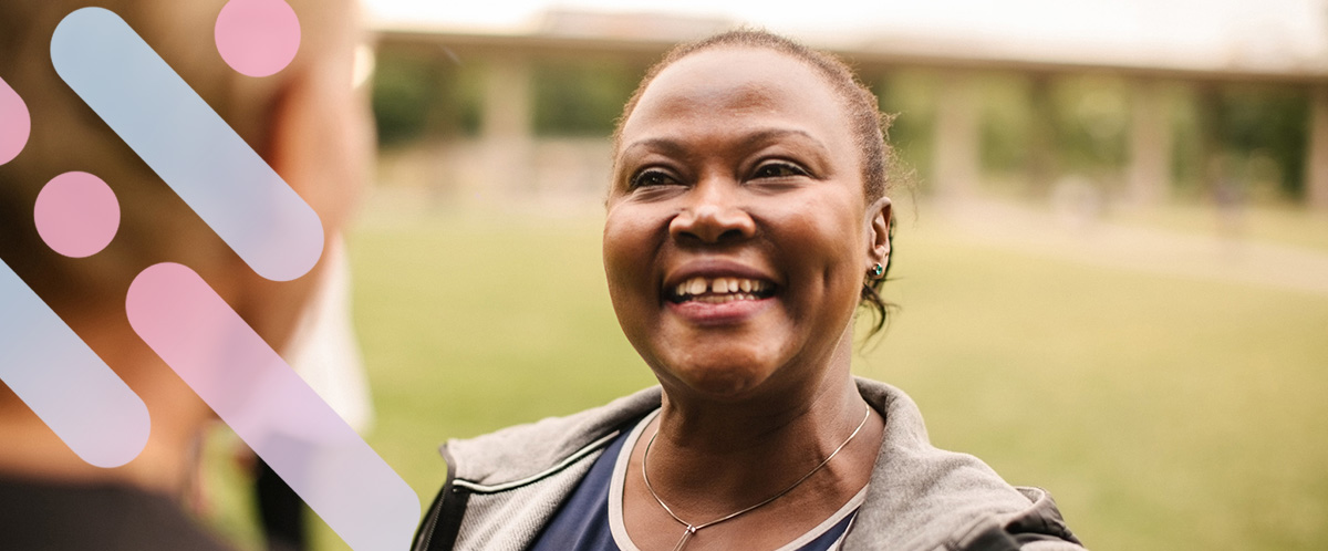 A woman smiles at a loved one