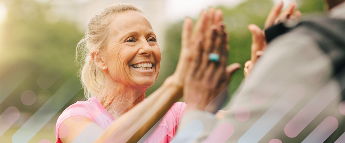 A woman high-fives another person