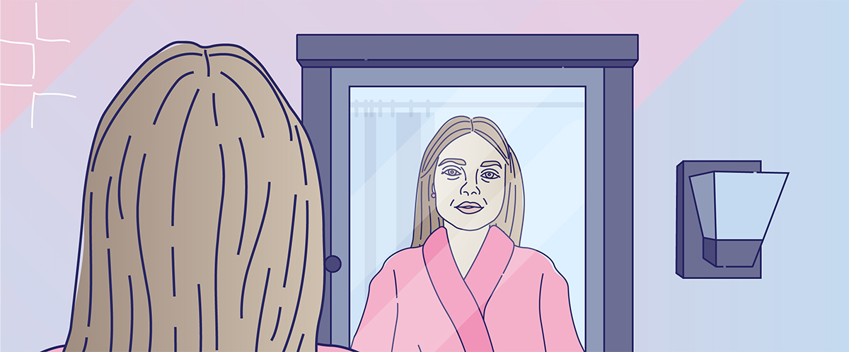 Woman looking into a mirror in preparation for sensory retraining